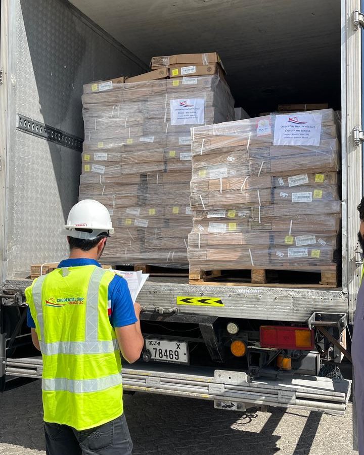 Credential Ship Services crew checking palletised bonded stores at a reefer truck for vessel delivery